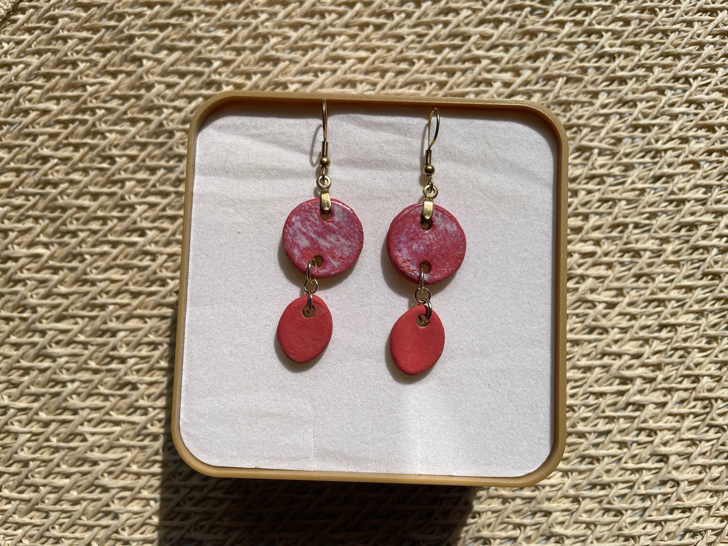 Les boucles d'oreilles Duo